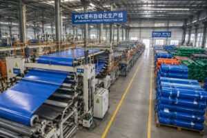 Factory workshop showing automated PVC tarpaulin production lines and finished product stacking areas